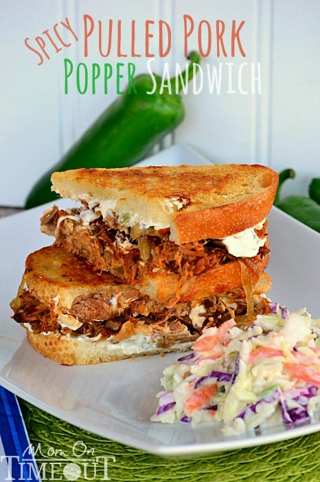 Spicy Pulled Pork Popper Sandwich | Mom On Timeout - Made with my favorite slow cooker pulled pork recipe, caramelized onions, and Spicy Jalapeño cream cheese - seriously good!