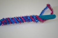 pipe cleaners wrapped around popsicle stick