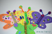 Easy butterfly craft for kids collage with three butterflies made with foam and popsicle sticks 