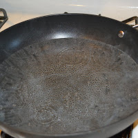 water simmering in skillet