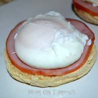 eggs benedict assembled on a white plate