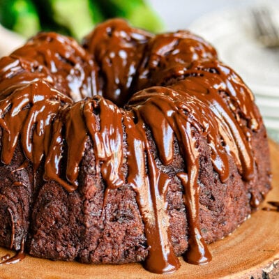 close up look at chocolate zucchini cake with chocolate glaze.
