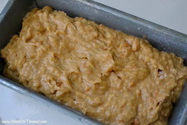 loaf pan with the banana bread batter spread out