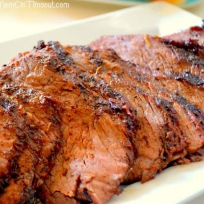 beef tri tip sliced on white plate