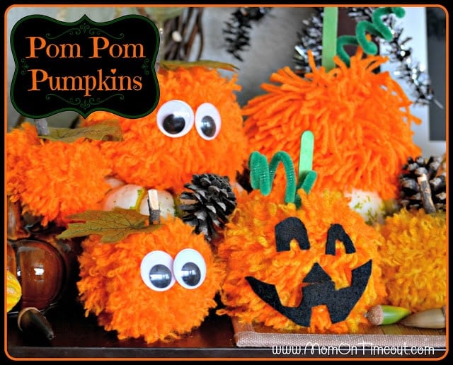 Make these Pom Pom Pumpkins with the kids this Halloween season! Super fun and SO easy too!  | MomOnTimeout.com