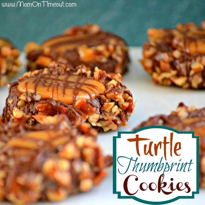 Get ready to impress with this easy Turtle Thumbprint Cookies recipe! Decadent chocolate cookies rolled in pecans and filled with soft caramel make any cookie tray look extra special! Perfect for the holidays! // Mom On Timeout #cookies #chocolate #recipe #caramel #pecans
