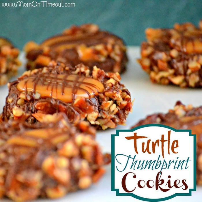 Turtle Thumbprint Cookies from MomOnTimeout | Delectable chocolate cookies filled with caramel. #recipe #cookie #turtle Get ready to impress with this easy Turtle Thumbprint Cookies recipe! Decadent chocolate cookies rolled in pecans and filled with soft caramel make any cookie tray look extra special! Perfect for the holidays! // Mom On Timeout #cookies #chocolate #recipe #caramel #pecans