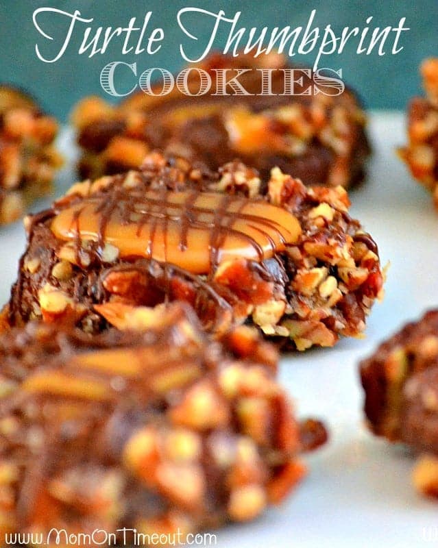 Get ready to impress with this easy Turtle Thumbprint Cookies recipe! Decadent chocolate cookies rolled in pecans and filled with soft caramel make any cookie tray look extra special! // Mom On Timeout #cookies #chocolate #recipe #caramel #pecans