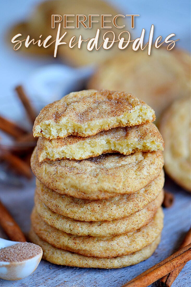 snickerdoodles stacked on blue board with top cookie broken in half text overlay at top