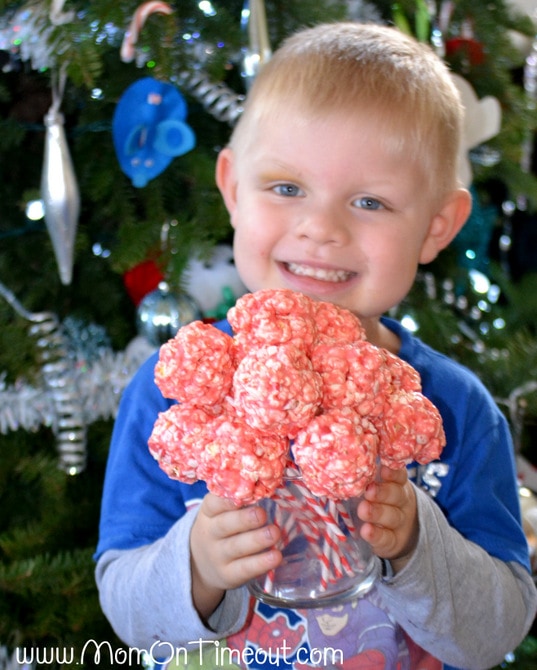 Marshmallow Peppermint Crunch Popcorn Ball Pops | MomOnTimeout.com