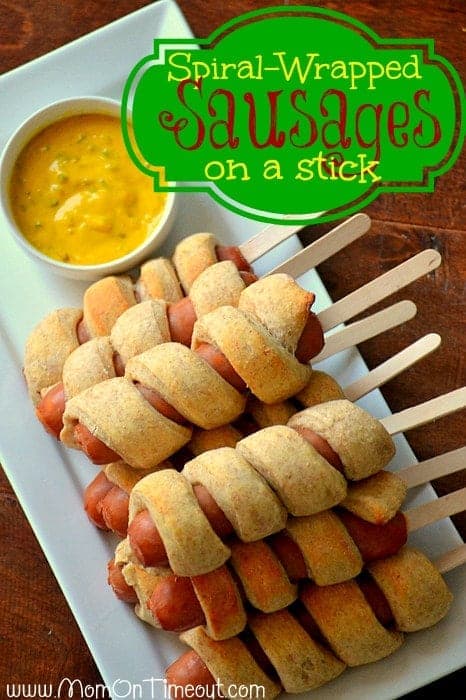 Spiral-Wrapped Sausages on a Stick from MomOnTimeout.com | Use your favorite sausage or hot dog and make up a bunch - perfect for a crowd! #recipe #party #superbowl #football
