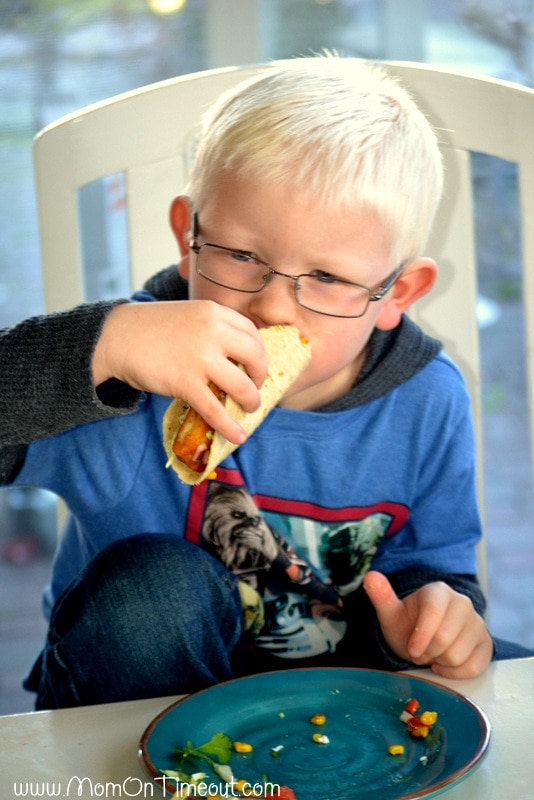 Reece-enjoying-fish-tacos