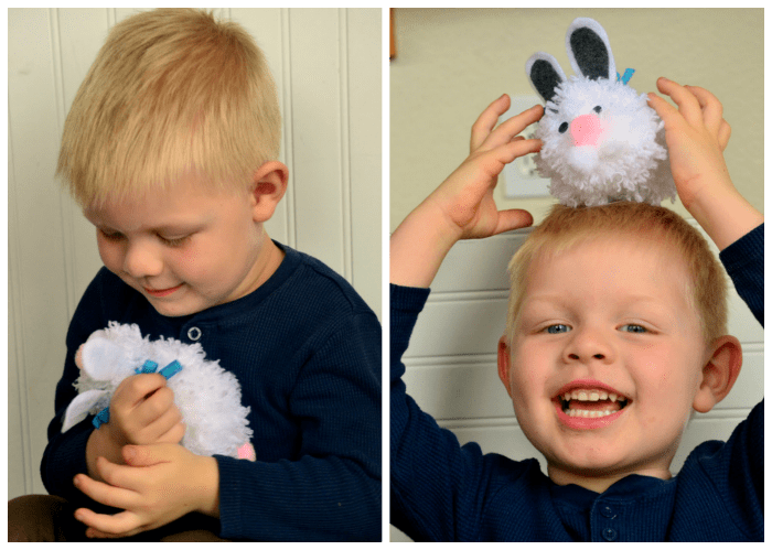 Bryce-playing-with-pom-pom-bunny