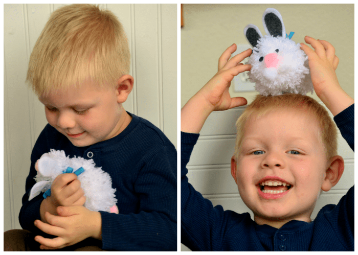 Bryce-playing-with-pom-pom-bunny