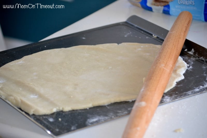 rolling out sugar cookie dough