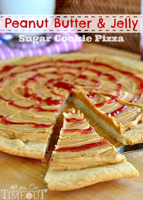 peanut butter and jelly cookie pizza with slice cut