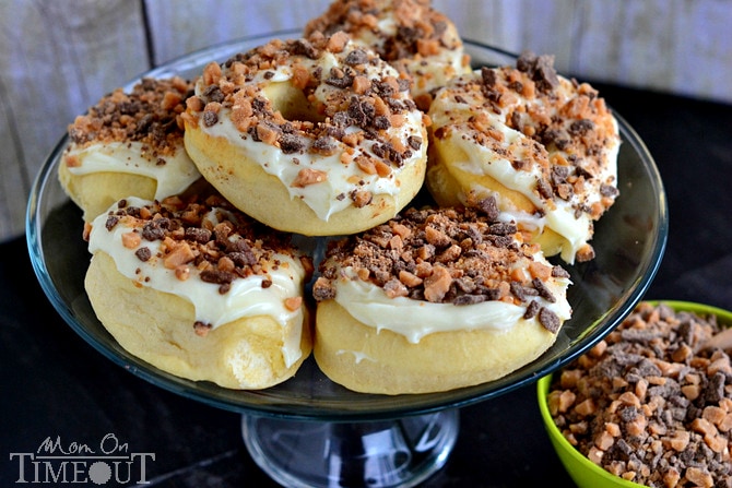 Bring the Heath Doughnuts - Gourdough's Copycat from MomOnTimeout.com | A baked yeast doughnut topped with cream cheese frosting and Heath candy pieces.