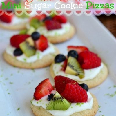 fruit basket sugar cookie pizzas on white tray with title overlay