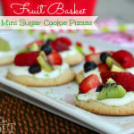 fruit basket sugar cookie pizzas on white tray with title overlay landscape view