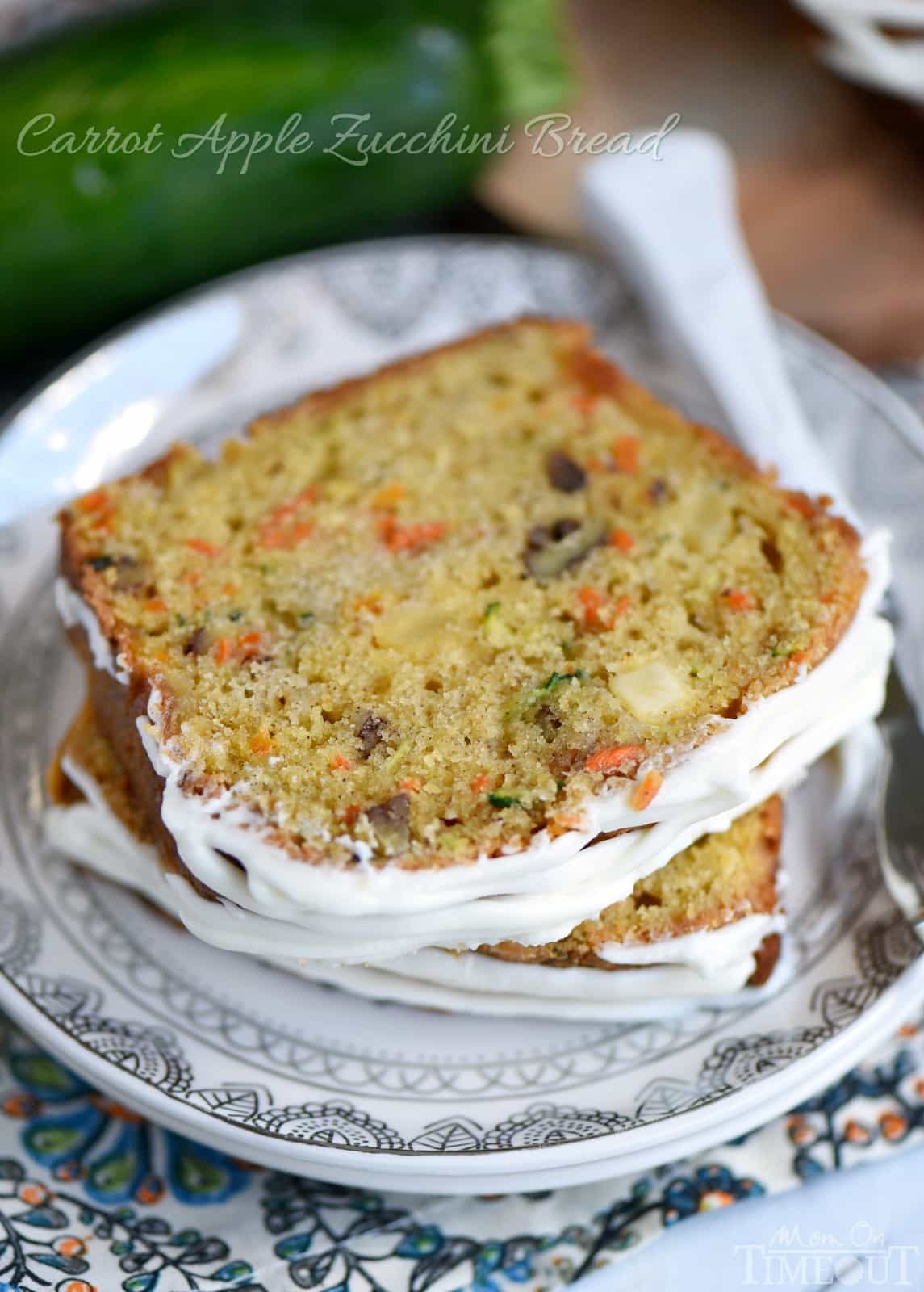 This Carrot Apple Zucchini Bread recipe is incredibly moist and flavorful! Vibrant colors from the carrot, apple, and zucchini makes this quick bread irresisitble!  Sure to be a new favorite! // Mom On Timeout