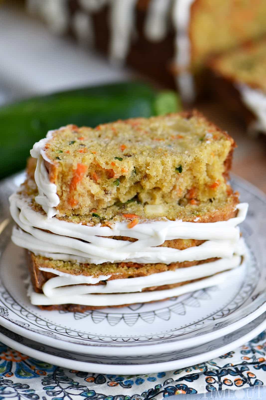 This Carrot Apple Zucchini Bread recipe is incredibly moist and flavorful! Vibrant colors from the carrot, apple, and zucchini makes this quick bread irresisitble!  Sure to be a new favorite! // Mom On Timeout