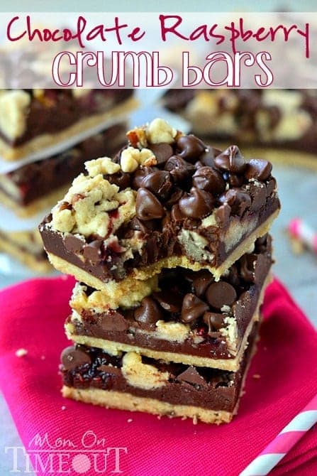 Chocolate Raspberry Crumb Bars stacked on pink napkin