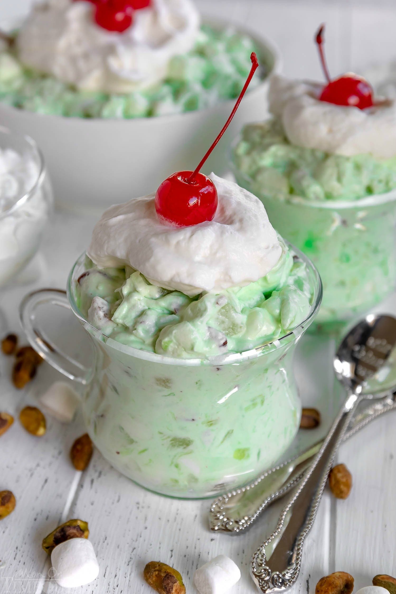 watergate-salad-recipe-topped-with-whipped-cream-marschino-cherry