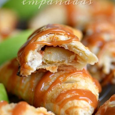 half a caramel apple empanada sitting on top of a whole empanada all drizzled with caramel sauce. title overlay at top of image.
