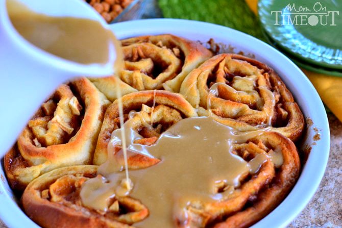 Craving caramel apples? Try these Caramel Apple Cinnamon Rolls for a sweetly satisfying breakfast treat! These gorgeous rolls are topped with a mouth-watering caramel icing and filled with Granny Smith apples and caramel. | MomOnTimeout.com