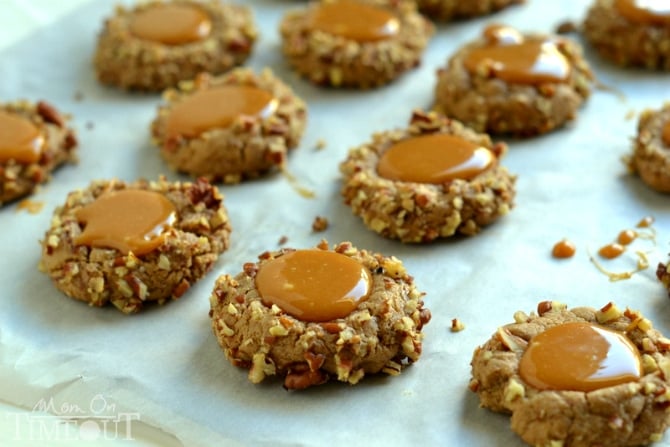 These Caramel Spice Thumbprint Cookies start with a spice cake mix and end with a white chocolate drizzle - cookie perfection! | MomOnTimeout.com