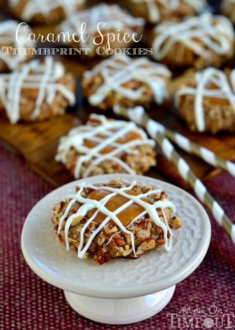 These Caramel Spice Thumbprint Cookies start with a spice cake mix and end with a white chocolate drizzle - cookie perfection! | MomOnTimeout.com