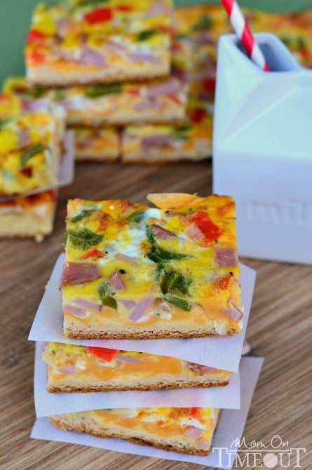 Ham and Cheese Breakfast Bars are loaded with veggies, ham and cheese and baked on a crescent roll crust! Serve with a cold glass of milk for the perfect breakfast or brunch! | MomOnTimeout.com #sponsored
