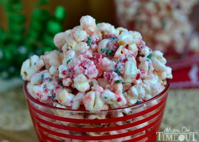 You're going to love the fabulous flavor and satisfying crunchy sweetness of this Peppermint Crunch Popcorn! It takes just minutes to prepare and would make the perfect gift this holiday season! Take this to your holiday party and let the compliments roll in! | MomOnTimeout.com | #popcorn #Christmas #recipe