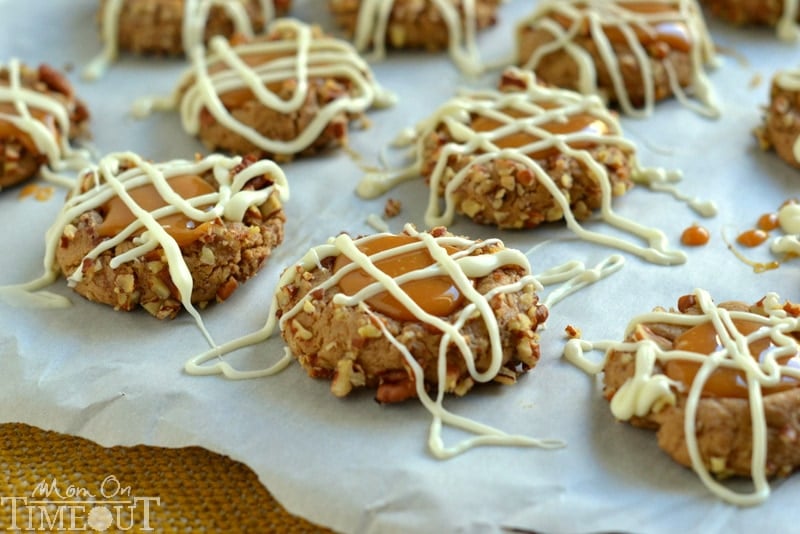 These Caramel Spice Thumbprint Cookies start with a spice cake mix and end with a white chocolate drizzle - cookie perfection! | MomOnTimeout.com