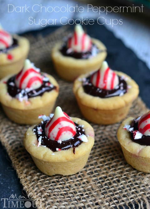 Dark Chocolate Peppermint Sugar Cookie Cups filled with chocolate ganache and topped with Candy Cane Hershey's Kisses. | MomOnTimeout.com #christmas #recipe