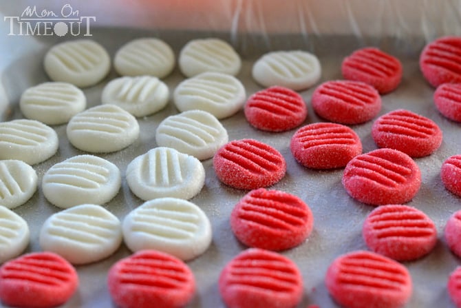 You're going to love this Easy Christmas Peppermint Patties recipe! Super easy to make, fantastically festive, and always a hit with kids and adults alike. These holiday treats are the perfect addition to cookie trays and make an excellent gift for teachers and friends! | MomOnTimeout.com #Christmas #candy #recipe