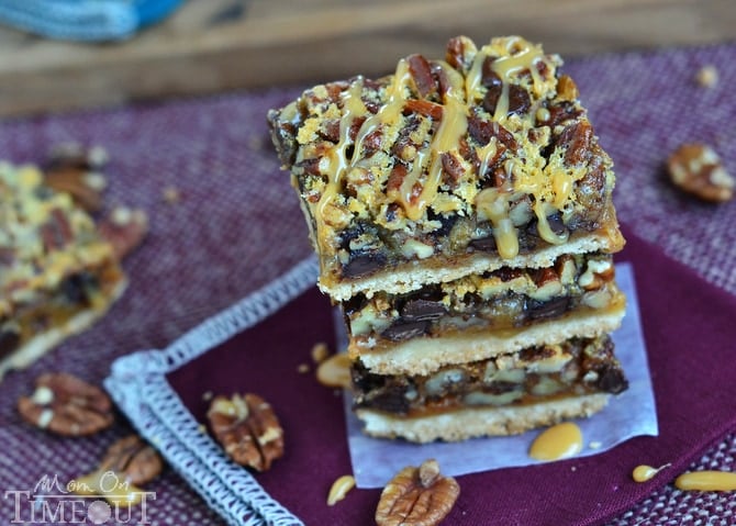 If you love pecan pie you're going to go crazy for these Turtle Pecan Pie Bars! Packed full of crunchy pecans, creamy caramel, and decadent chocolate, these bars are sure to satisfy your sweet tooth! | MomOnTimeout.com #sponsor #pie #turtle