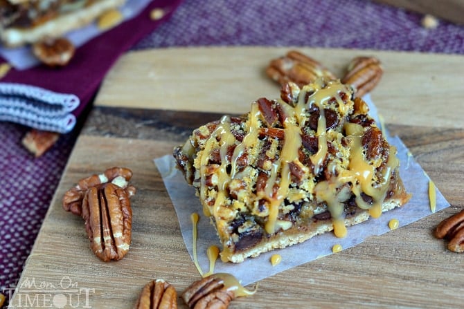 If you love pecan pie you're going to go crazy for these Turtle Pecan Pie Bars! Packed full of crunchy pecans, creamy caramel, and decadent chocolate, these bars are sure to satisfy your sweet tooth! | MomOnTimeout.com #sponsor #pie #turtle