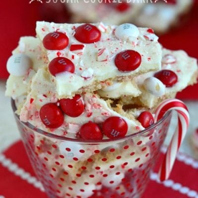 sugar cookie bark with red and white mandms in glass jar
