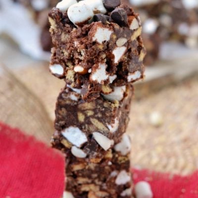 rocky road smores bars stacked four high on red napkin