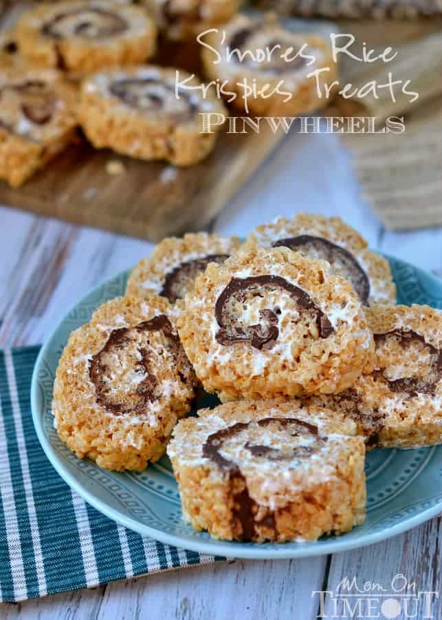 Say goodbye to boring squares and hello to these fun S'mores Rice Krispies Treats Pinwheels! Layers of marshmallow, chocolate, and graham cracker rice krispies treats are rolled up into the perfect bite-size package! Irresistible! // Mom On Timeout