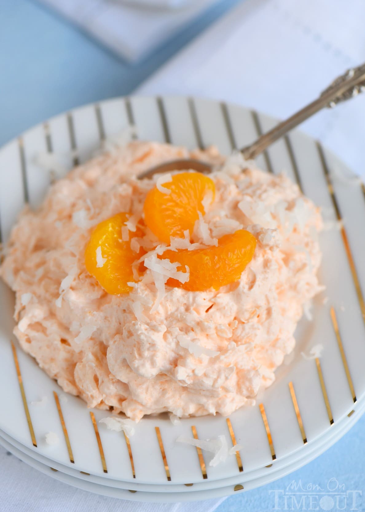 The refreshing flavors of orange, pineapple and coconut pair beautifully in this easy to make, one-bowl Tropical Orange Jello Salad! Great for parties, BBQs and picnics! // Mom On Timeout