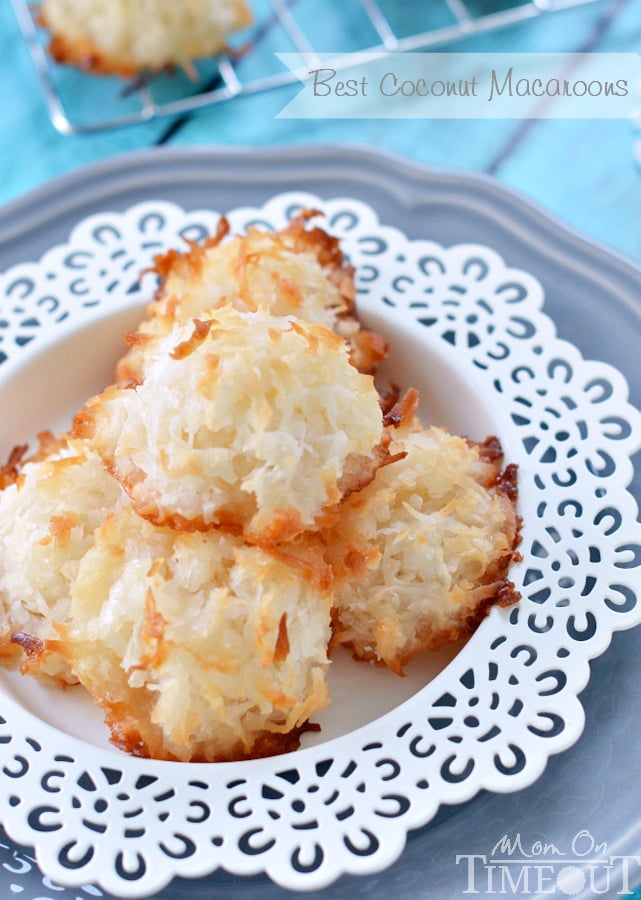coconut macaroons on white plate with blue background