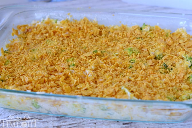 broccoli rice casserole with chicken and cheese in baking dish