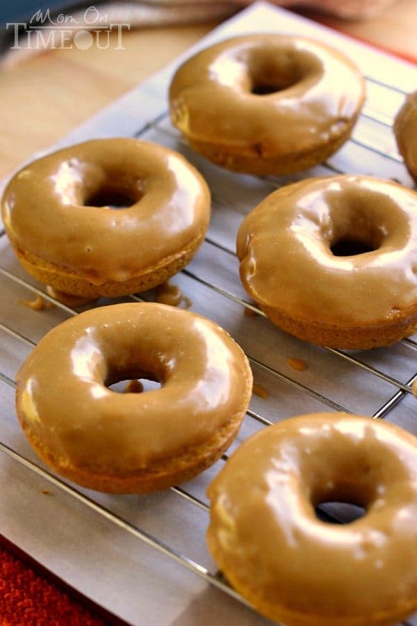 These easy Baked Pumpkin Spice Donuts with Maple Glaze are perfectly moist and bursting with flavor - the quintessential fall breakfast! | MomOnTimeout.com | #pumpkin #donut #doughnut #breakfast #recipe #IDelight