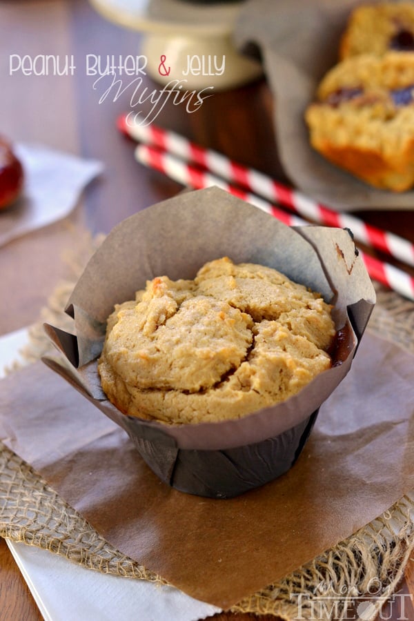 These amazing Peanut Butter and Jelly Muffins make for a delicious and satisfying breakfast on-the-go or a great after-school snack! | MomOnTimeout.com | #recipe #breakfast #snack #peanutbutter