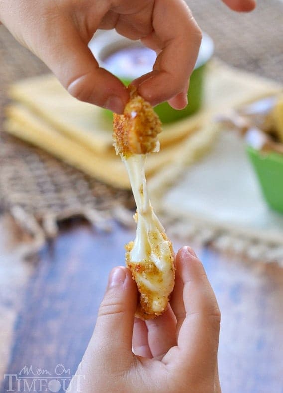 These Freezer-Friendly Baked Mozzarella Sticks are perfect for after-school snacks, late night munchies, and game day! | MomOnTimeout.com | #appetizer #cheese #recipe