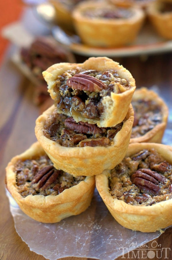 These Mini Chocolate Pecan Pies are a dream come true for the holidays! Sweet chocolate morsels are the perfect addition to traditional pecan pie and everybody loves this mini version! | MomOnTimeout.com | #dessert #Challenge Butter #PinaRecipeFeedaChild 