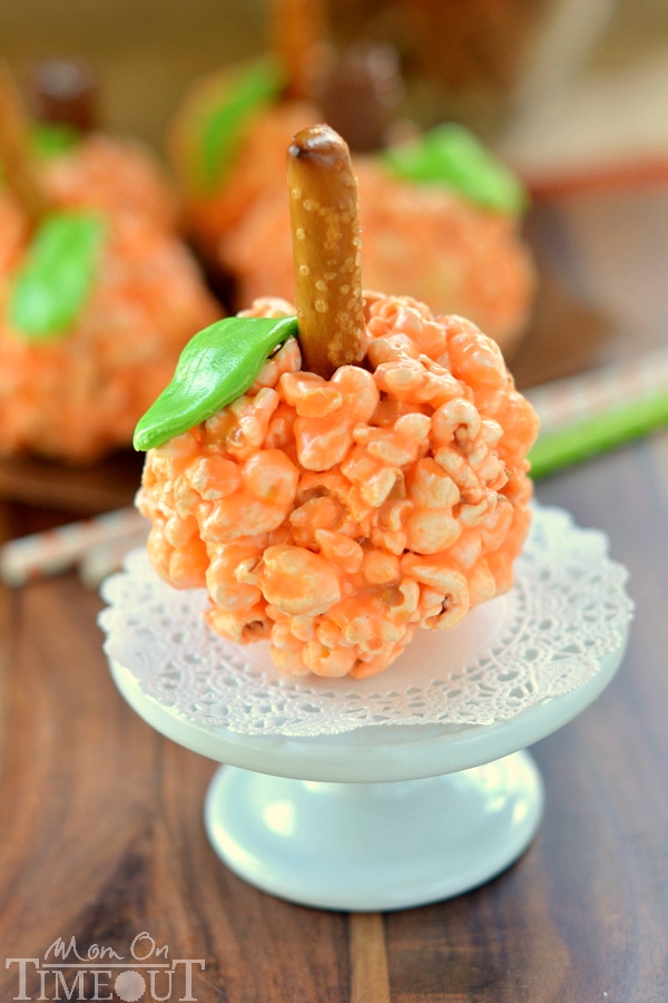 Fun and oh-so delicious, these Pumpkin Popcorn Balls are made with marshmallows for the ultimate soft and chewy treat! Perfect for Halloween and Thanksgiving! | MomOnTimeout.com | #recipe #Halloween Thanksgiving #kids