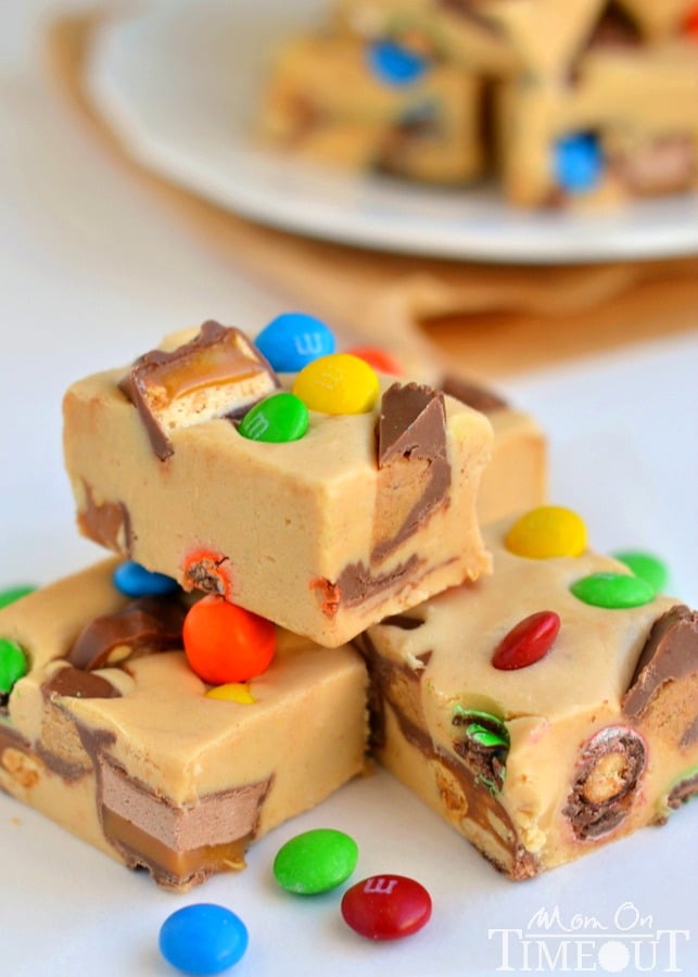 An excellent recipe for using up leftover candy and the perfect way to satisfy your sweet tooth - you simply must try this easy Peanut Butter Candy Bar Fudge recipe! | MomOnTimeout.com